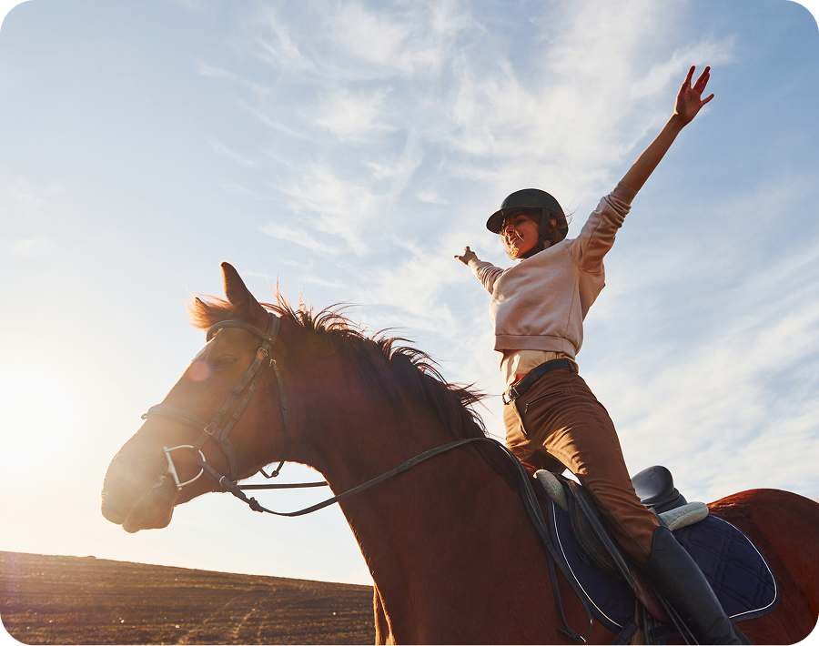 Joyful equestrian moment in open field