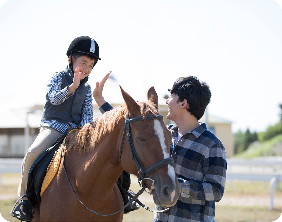 Boy and man with horse
