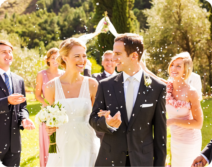 Bride and groom smiling at outdoor wedding