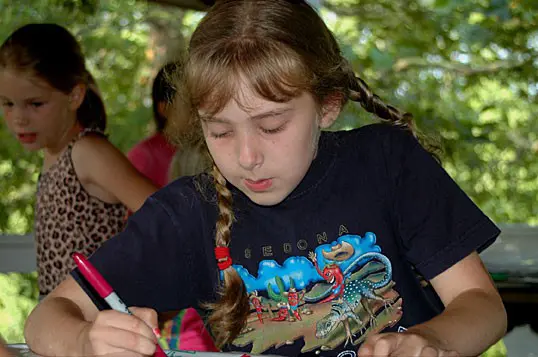 Young girl engaged in coloring task