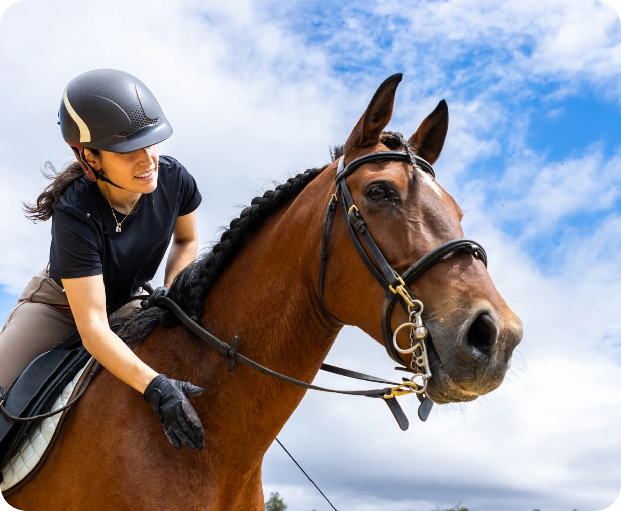 Woman enjoying horseback riding experience